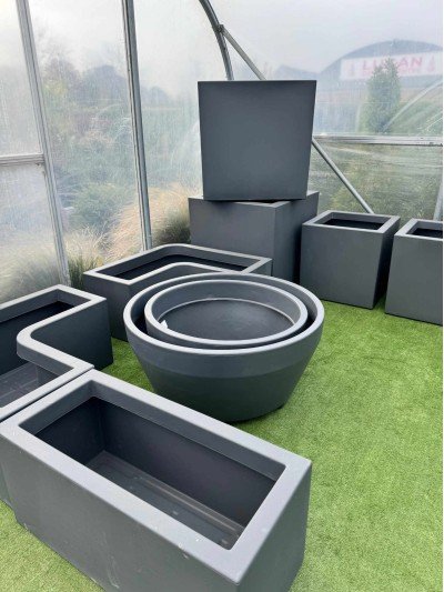 Selection of dark grey extra large troughs, pots and containers suitable for balcony gardening