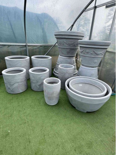 Selection of light grey extra large troughs, pots and containers suitable for balcony gardening